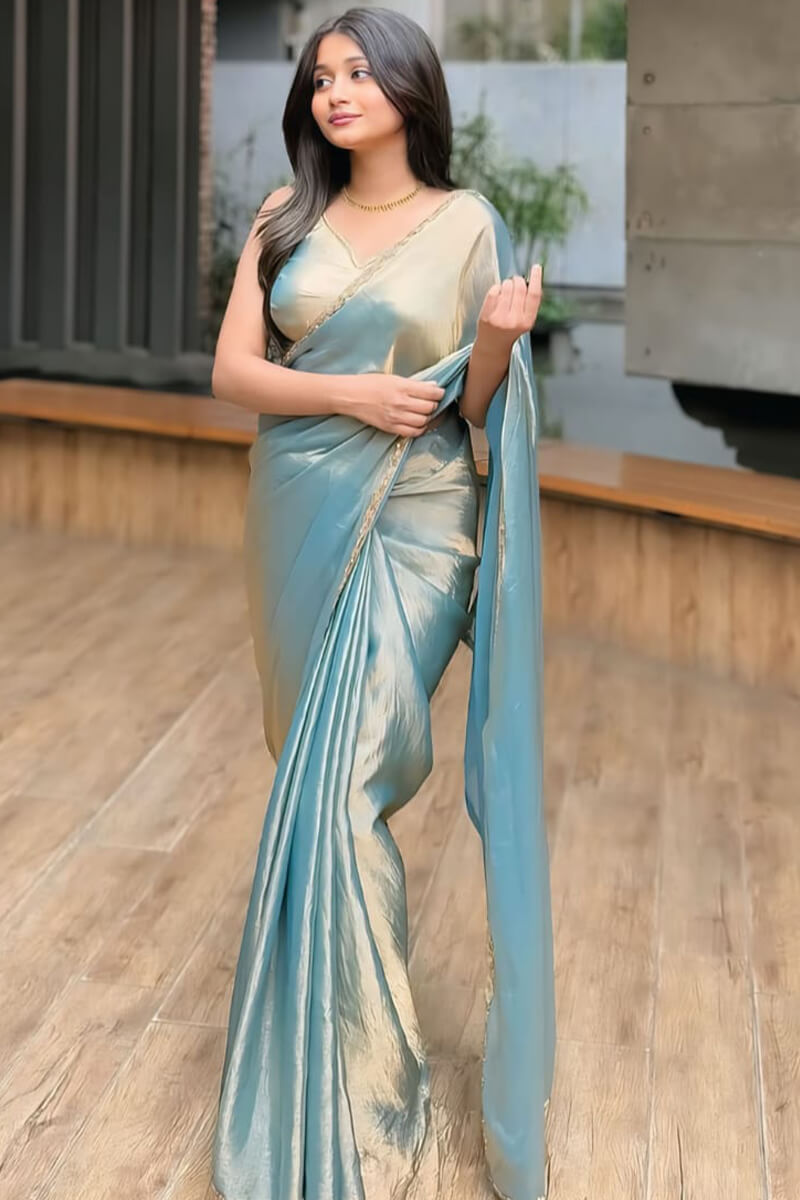 Glittering Firozi Fancy Silk Saree With Delightful Blouse Piece